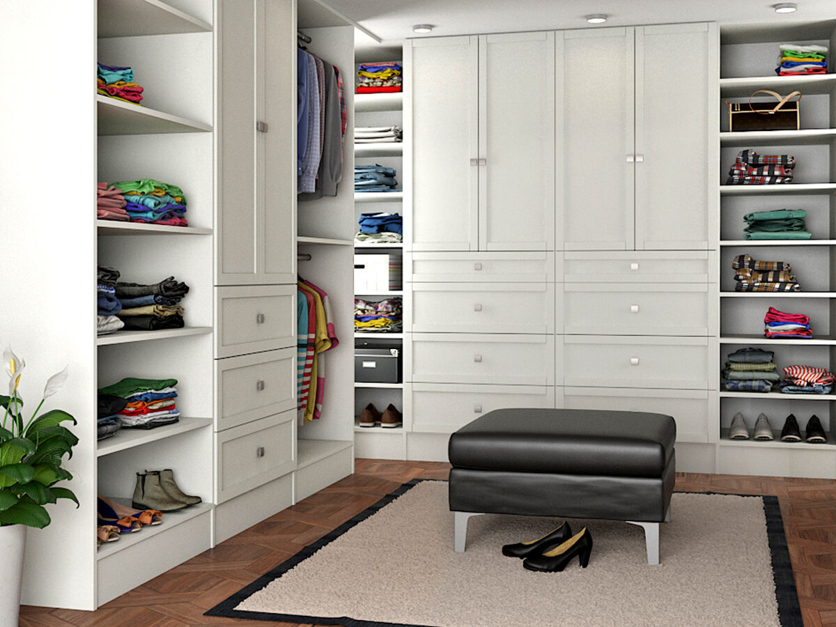 Custom white walk-in closet with island and LED lighting in Tulsa